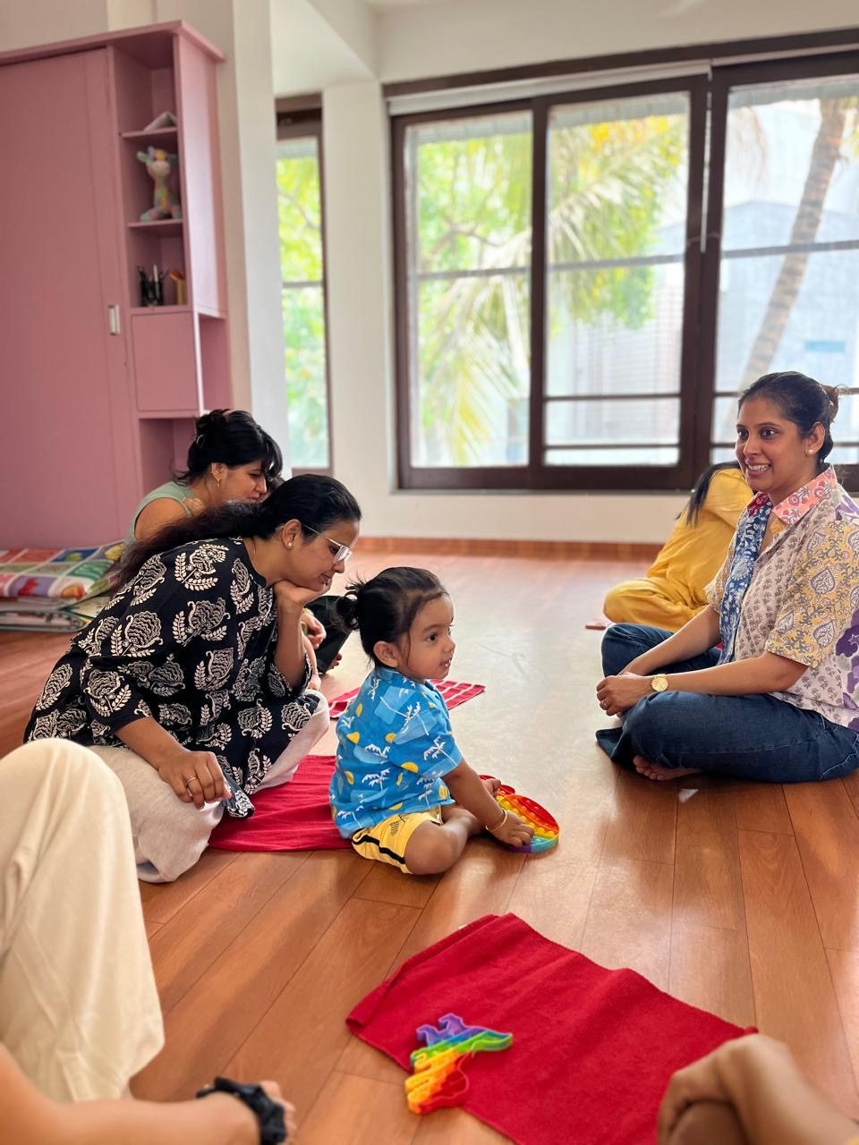 Parents with their toddler at an orientation session